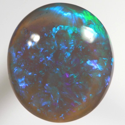 SOLID BLACK CRYSTAL OPAL Rolling flashes of green and turquoise fire in a 3D pattern